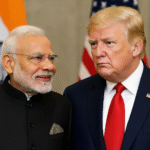 Indian Prime Minister Narendra Modi and former U.S. President Donald Trump standing together, with Indian and American flags in the background.