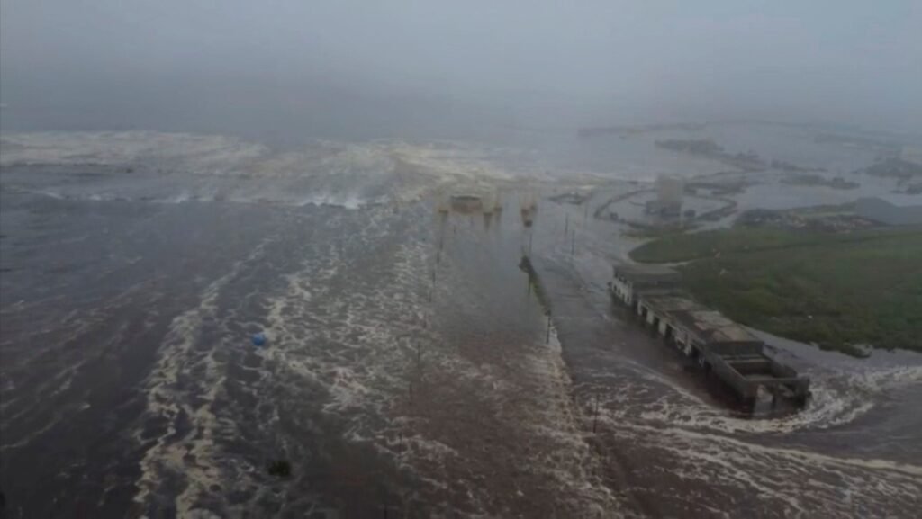 A dramatic depiction of an undersea earthquake near Russia's Kamchatka Peninsula with rising ocean waves and coastal tremors.
