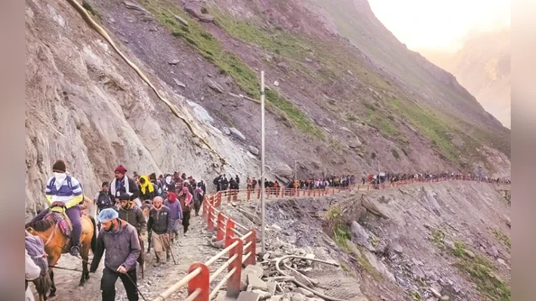 "A symbolic mountain trail in Kashmir with pilgrims turning back due to a blocked path, representing the suspension of the Amarnath Yatra amid scenic snowy peaks and warning signs indicating track maintenance."