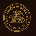 Reserve Bank of India emblem featuring a golden tiger walking past a palm tree inside a circular frame on a dark background.